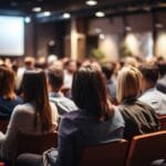 Speaker addresses audience of executive assistants.